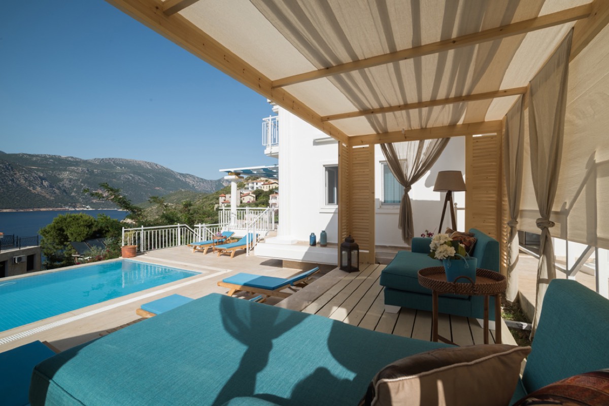 Shaded pool terrace of Villa Piri Reis with sea view