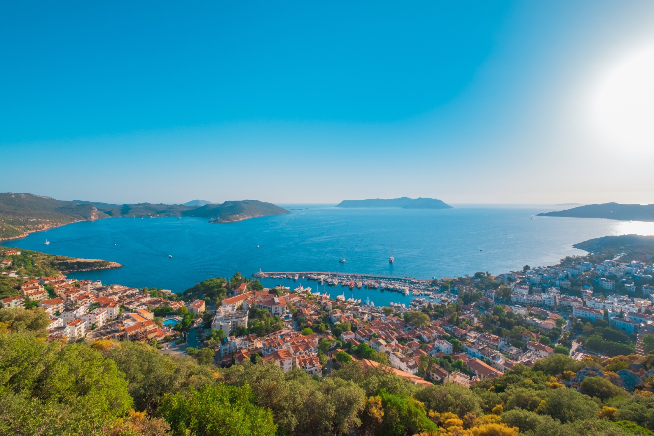 Aerial view of Kaş harbor and the sea toward the Greek island of Meis